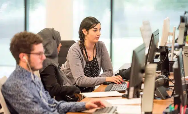 unknown persons using computer indoors